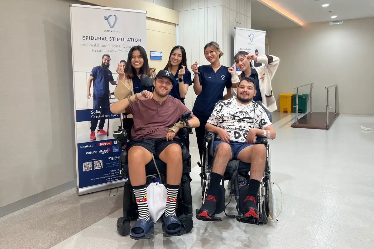 Verita Neuro - blog cover image - Improving spinal cord injury blood pressure regulation - Gavin's Interview showing Gavin in wheelchair surrounded by team