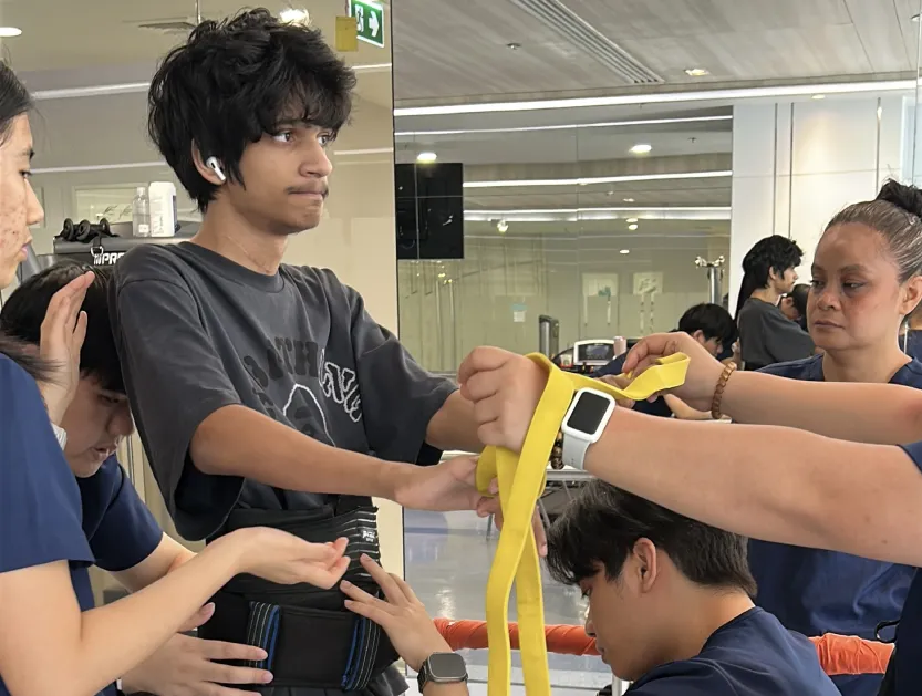 Patient Story Profile Picture - Afraz Syed supported by therapists during gait training at Verita Neuro