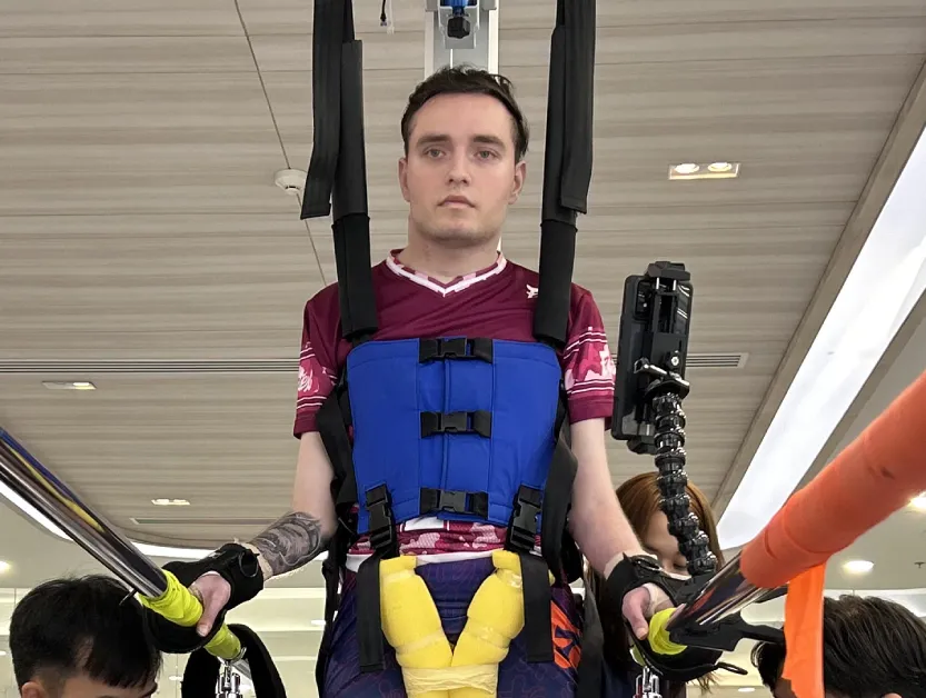 Patient Story Profile Picture - Close-up image of Nikita using body-weight support harness during treatment at Verita Neuro